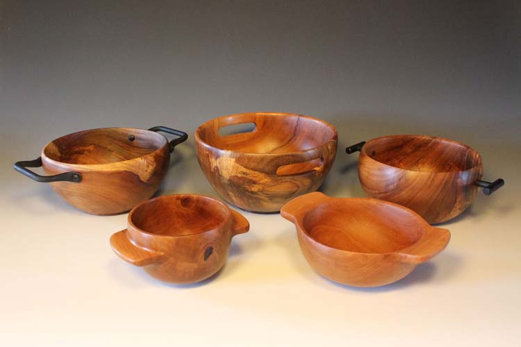 Collection of wooden bowls with various types of handles